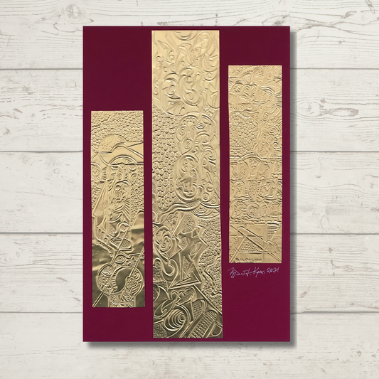 A triptych metal composition of 3 separate  golden foil engravings mounted on a burgundy background cardboard.