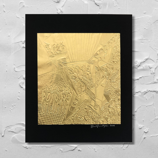 A gold-plated, engraved mixed metal foil art piece with an intricate pattern, mounted on a black background, with the artist's signature at the bottom.